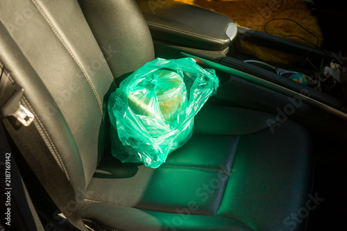 bag with food left on a car seat