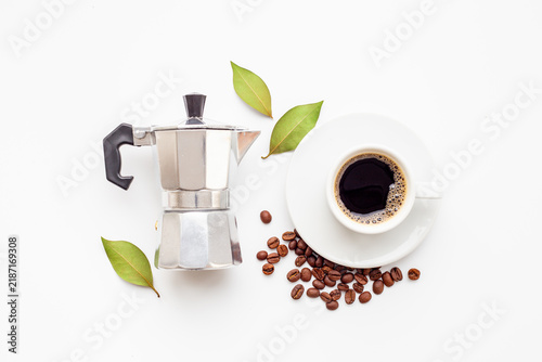 Bild auf Leinwand Fresh black coffee brewed in moka pot with coffee leaves - natural coffee experi