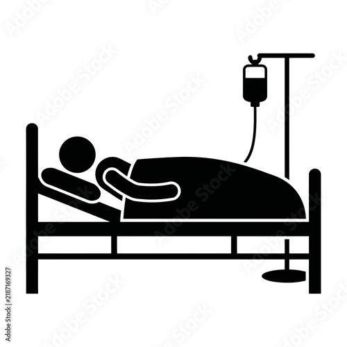 Silhouette of Patient in Hospital Bed with Intravenous Drip