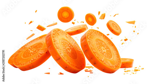 Sliced, bright orange vegetable pieces, some circular, others irregular, isolated on black