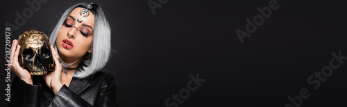 Fotografie Young woman embracing her witchy aesthetic with gothic charm for Halloween