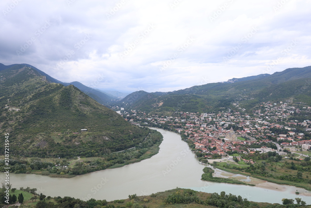 Fototapeta premium Panoramic View of Confluence of Mtkvari and Aragvi Rivers and Ancient City of Mtskheta, Georgia