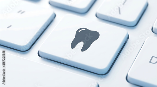 Online Dental Care Concept with Tooth Icon Key on Computer Keyboard for Booking