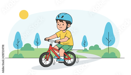 Little boy wearing a safety helmet riding a red balance bicycle on a winding path through the green park.
