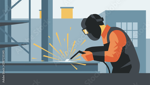 Industrial construction welder wearing protective helmet while working with flying bright sparks in a metal workshop.
