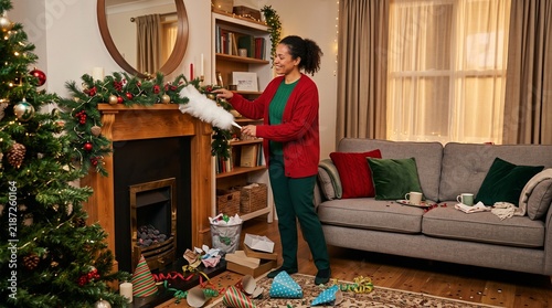 Obraz na płótnie Cleaner resets a festive living room after a party
