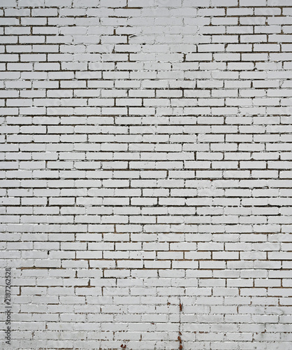 Принти на полотні White painted brick and mortar wall showing flat smooth brick faces with cracked