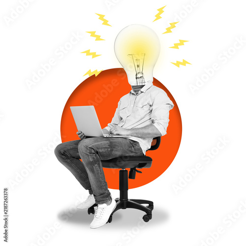 Bild auf Leinwand A person sits with a laptop on their lap at a desk