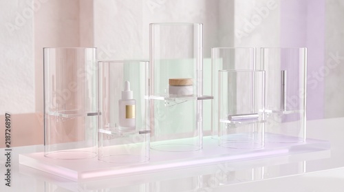 Multiple cylindrical glass cosmetic product display stands arranged neatly for luxury retail goods on transparent background