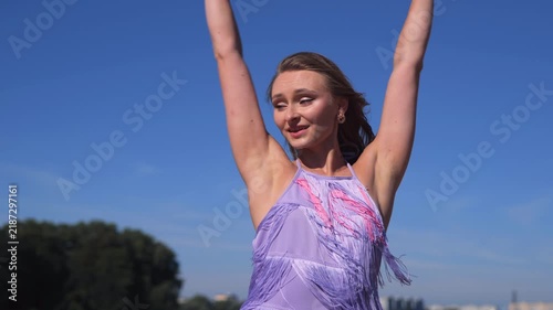 Romantic Female Model In Revealing Short Summer Dress On Riverside Beach. Dancing Gracefully And Relaxing In The Warm Summer Sun.