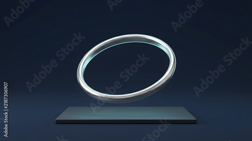 Gleaming silver ring, suspended in the air above a dark, rectangular platform wallpaper backgrond