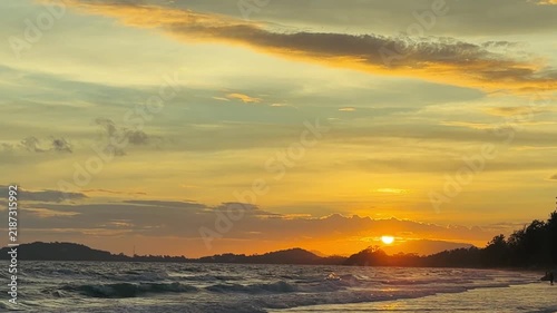 Calming ocean wave ripples on the beach at golden hour
