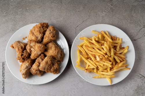 Dominican style pica pollo fried chicken served with french fries