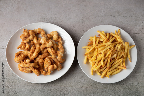 Crispy fried chicken tenders served with golden french fries