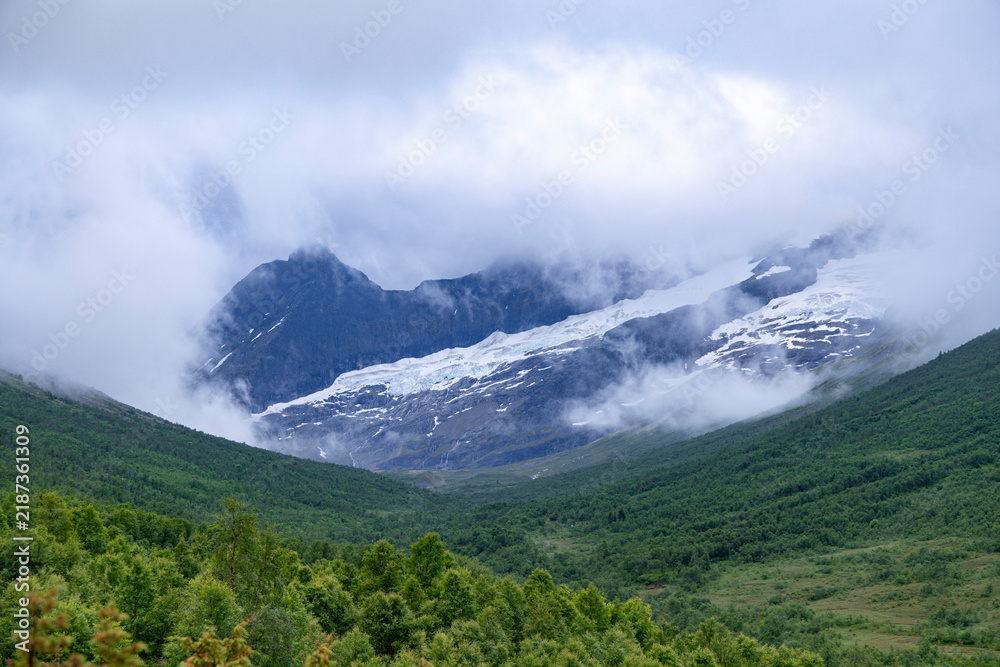Obraz premium A beautiful summer mountain valley landscape near Norddal vilage. A seasonal scenery of World Heritage area in Western Norway.