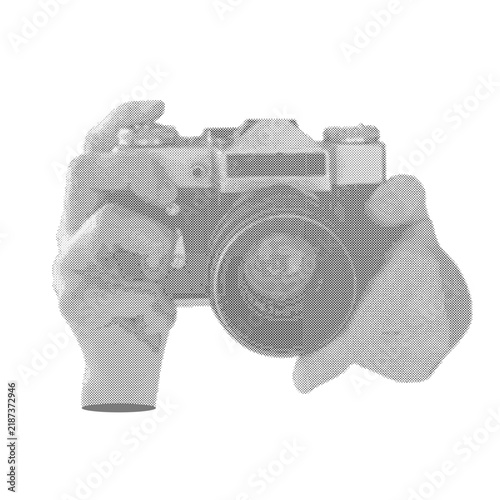 Hands holding SLR camera halftone isolated