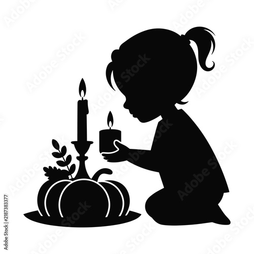 Little girl silhouette holding small candle near pumpkin candlestick decoration on floor