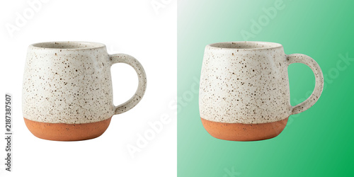 Quadro su tela Speckled ceramic coffee mug with terracotta base on white background