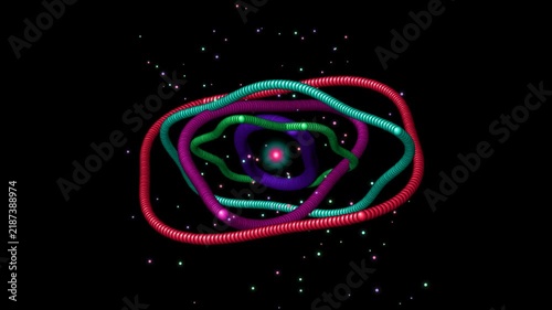 Futuristic 3D motion graphic of colorful glowing atomic rings rotating in dark space with particles