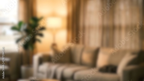 Blurred interior background of bright living room with couch for product display backdrop
