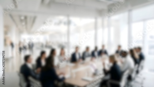 Defocused background of corporate seminar meeting in modern spacious glass conference hall