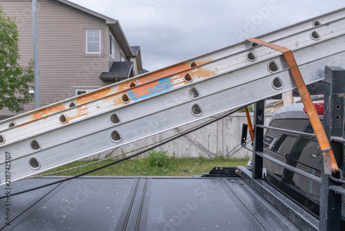 Extension ladder on the back of work truck