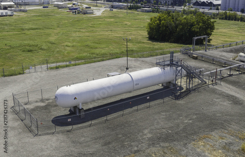 Aerial view of a large horizontal pressurized storage vessel at the Marathon Petroleum facility, surrounded by a chain-link fence in Nashville, TN, United States.