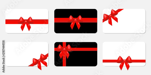 A set of gift cards with red bows on a white and black background