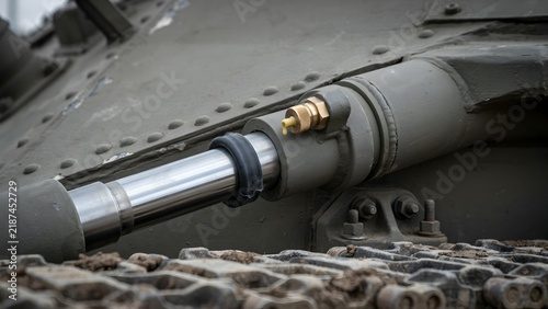 Close-up of tank gun barrel and mechanical components on military vehicle