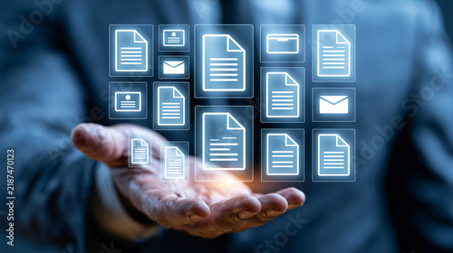 A professional hand reaching out, showcasing digital documents and files in a transparent interface