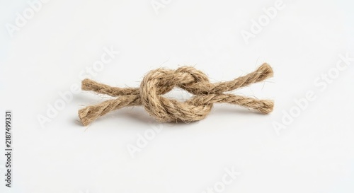 Simple overhand knot made from natural jute rope.