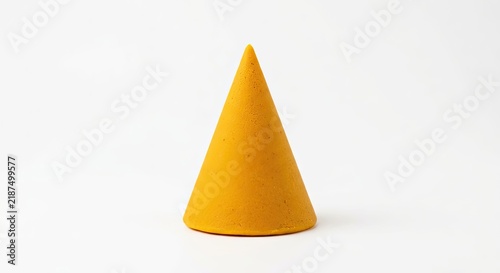Solid yellow geometric cone on white.