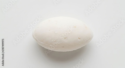 White oval soap bar on white background.