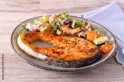 Air fried salmon steak with salad