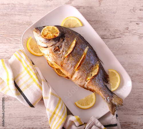 Fototapeta Baked lemon sea bream fish