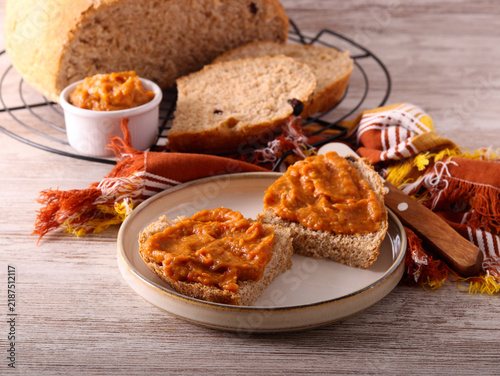 Fototapeta Homemade brown bread with vegetable spread