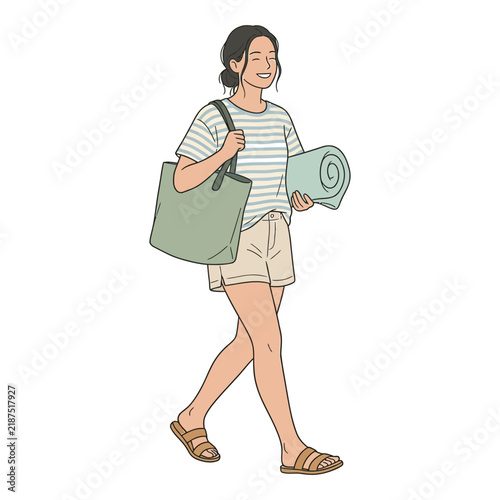 A cheerful young woman with a tote bag and rolled-up towel walks with a relaxed stride, embodying a leisurely summer day