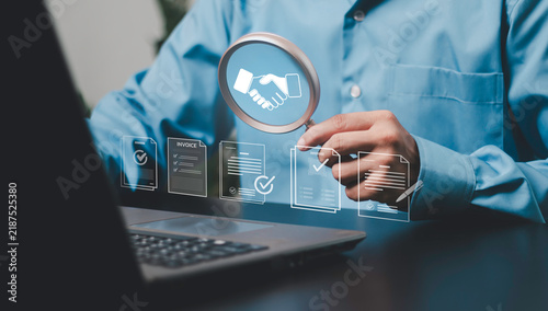 Procurement, business deals, contracts, cooperation, partnerships, negotiation and corporate agreements. Businessman examining handshake agreement, magnifying glass with digital documents.