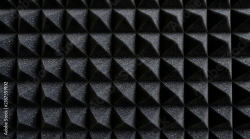 Close up of a black pyramid textured wall creating a striking geometric pattern for modern backgrounds