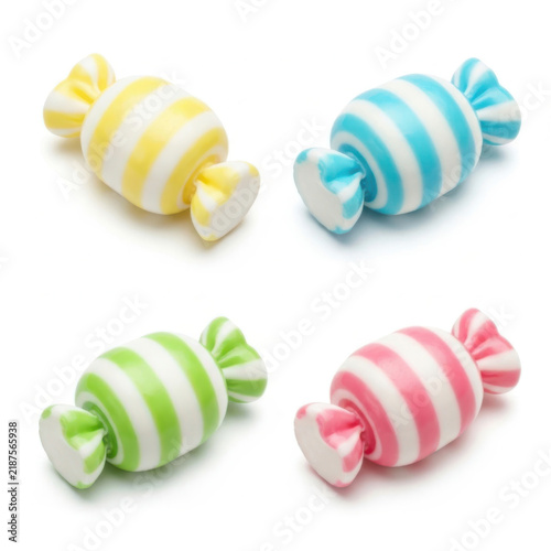 Set of four colorful striped wrapped hard candies in pastel colors