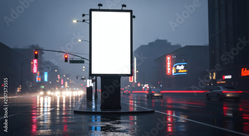 Urban nighttime street with blank billboard and traffic lights in rainy weather
