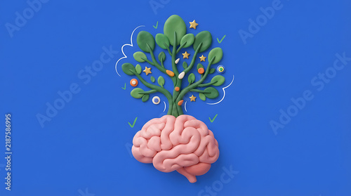 Creative brain with green plant growing from top on blue background