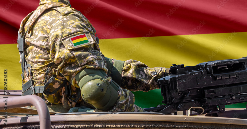 Obraz premium Bolivia flag with soldier at machinegun turret
