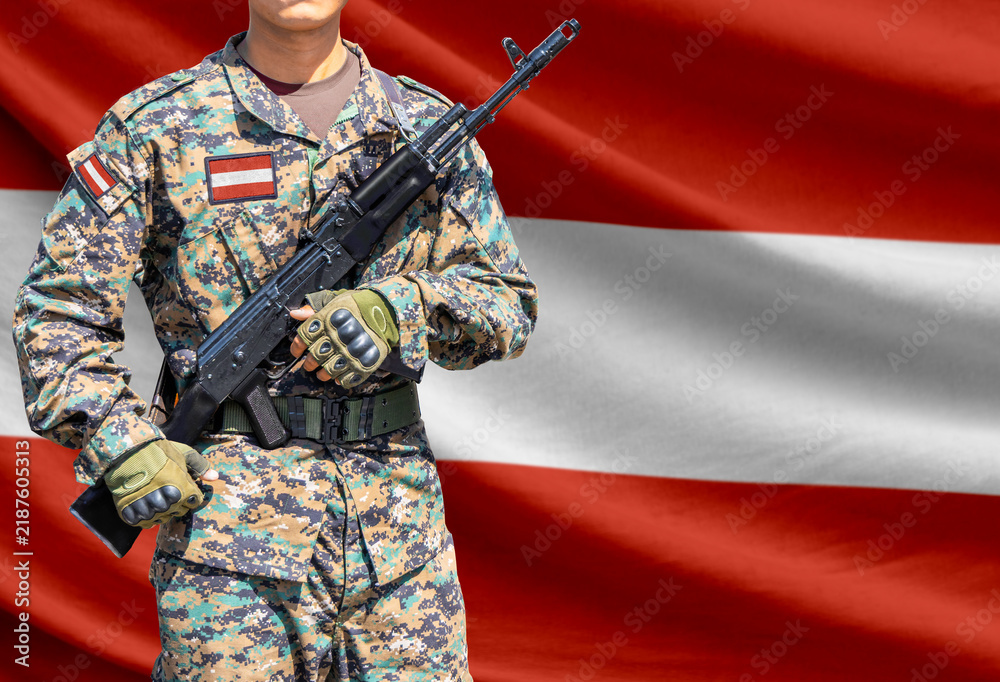 Obraz premium Austria flag with soldier holding assault rifle