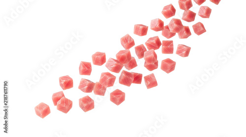 Raw tuna fish cubes falling isolated on transparent background