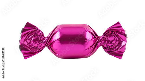 A single piece of candy wrapped in shiny magenta foil isolated on transparent background