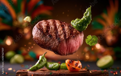 Sizzling Steak with Garnishes on a Cutting Board Set Against a Festive Background