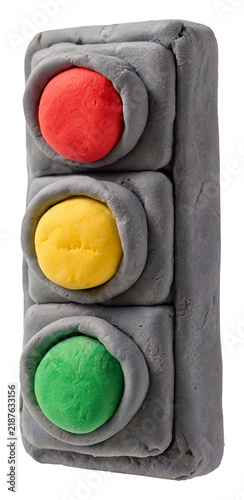 Handmade traffic light model made from gray plasticine with colorful lights