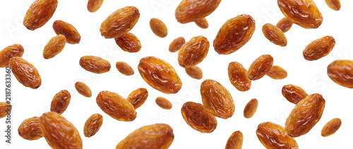 Obraz na plátně Falling raisins isolated on transparent background