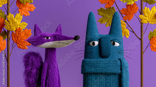 Verspielte Waldtiere in einer herbstlichen Fantasiewelt mit Regen, bunten Blättern und weicher Woll- und Filzoptik in kräftigen Violett-, Türkis- und Orangetönen.